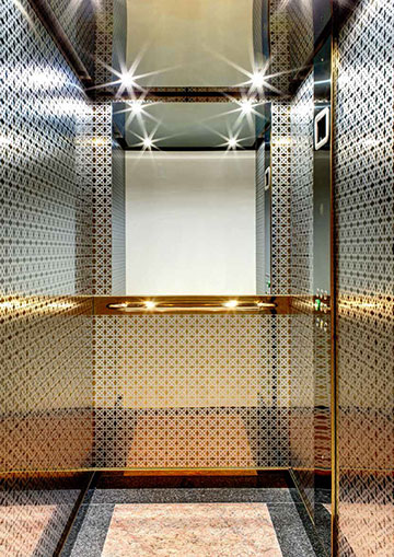 Gold, stainless lift cabin